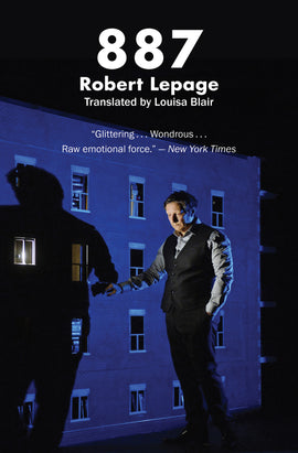  It is nighttime. A photograph shows blue light shining on a brick building with four rows of windows. A man with light skin tone who is as tall as the highest windows stands beside the building. He wears a vest over a button-up shirt and leans on the wall. His shadow on the building is stopped by one lit window on his shadowÕs chest. A spotlight shines on his face. He looks to the ground. Text: 887. Robert Lepage. Translated by Louisa Blair. ÒGlitteringÉ WonderousÉ Raw emotional force.ÓÑ New York Times. 