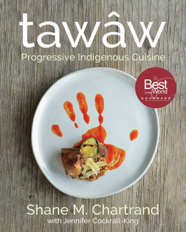  A photograph shows a white plate on a wood table. The food on the plate is decoratively arranged. Orange sauce has been placed with a hand to show a handprint. On top of the handprint is a delicate tower of grains, vegetables, and meat. Text: Tawâw. Progressive Indigenous Cuisine. Shane M. Chartrand with Jennifer Cockrall-King. Best in the World Gourmand World Cookbook Awards. 