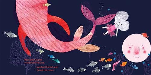  Underwater, the water is black. A girl in a pink tutu hangs on to the tail of a giant pink fish. Smaller fish in blue, orange, and black and white swim around. The moon is underwater and is pink. It has a face and watches the girl. Small blue stars surround it. A bare tree and coral come up from the ground. Text: I swirled the fish and I found the moon. Text is also in Spanish. 