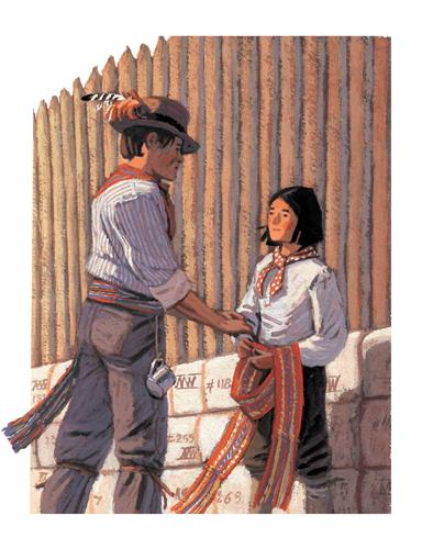 A man with light skin tone and an older boy with light skin tone stand beside a wood fence. The man has his hands on the boy’s arm. He is wearing a hat with feathers and has a red sash with coloured stripes wrapped around the waist of his pants. The boy holds a similar sash in his hands. 
