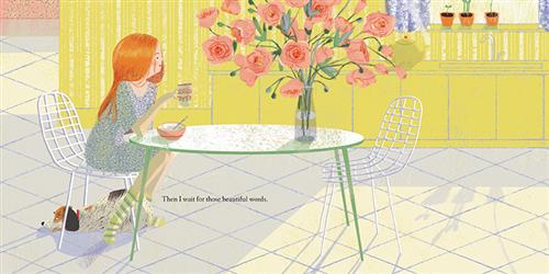  A kitchen in a home has yellow walls and cabinets and white floors. The round kitchen table is green and has two chairs made of white rods. A woman with light skin tone and orange hair sits at the table holding a mug. A bowl is in front of her. A dog lies on the ground beneath her chair. A big bouquet of pink flowers sits on the table. It extends up and out of the frame. Text: Then I wait for those beautiful words. 