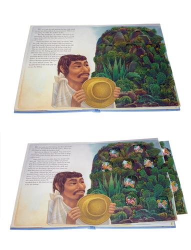  This image shows a photograph of a pop-up book in two parts. The first part shows a page with a picture of a man with medium skin tone holding a hat beside a hill of cactus plants. The second part shows the same picture, but with a section of the page pulled out of the book to reveal pictures of flowers on the hill amongst the cactus plants. 